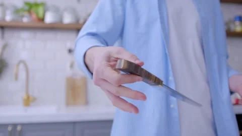 A trick with a carving knife above the table. Stock Footage 134232008
