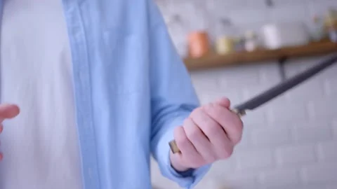 A trick with a carving knife above the table. Stock Footage 134232064