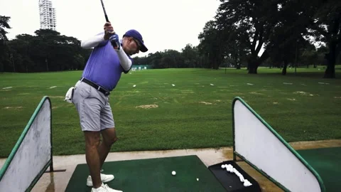 The trick to hitting a golf ball is to practice proper form Stock Footage 280887398