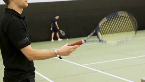 A trick with a racket. Warm-up before the game. Stock Footage 125271070
