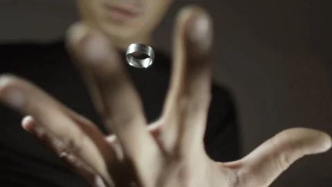 The trick with the ring. Ring hangs in the air. Levitation ring in the hand of Stock Footage 89581770