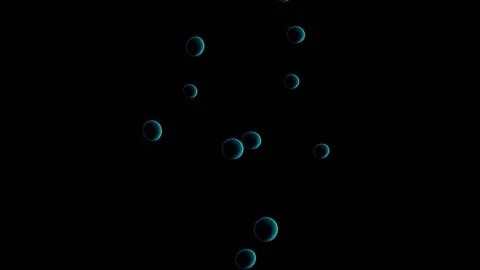 A trickle of large opaque blue bubbles tends upward against a black background. Stock Footage 153284013