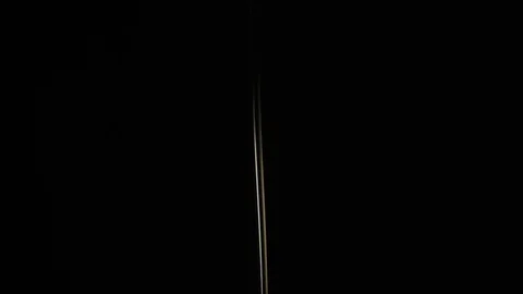 Trickle of oil on a black background, pouring, swaying, slow mo Video stock 74345145