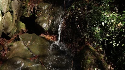 Trickling waterfall slipping down rock path slow motion creek 動画素材 86888390