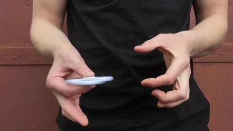 Tricks with a hand spinner Stock Footage 78784250
