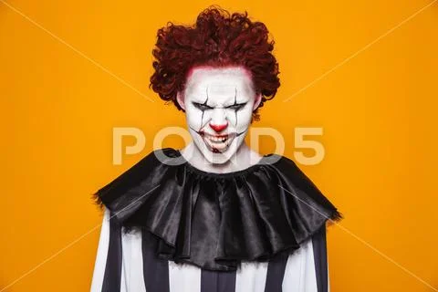 Tricky scary man clown looking camera Stock Photos