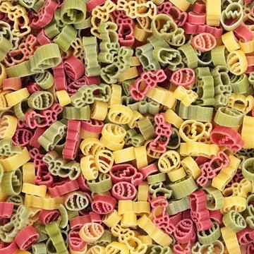Tricolor Dried Pasta with Easter Shape Symbols Stock Photos