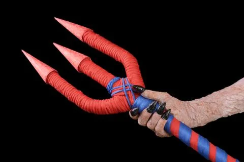 Trident in the hand of the devil is a fictional being Stock Photos