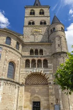 Trier Cathedral facade with large clock tower Stock Photos