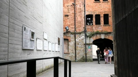 Trieste, Italy, visitors inside the Risiera of San Sabba Stock Footage 244085988