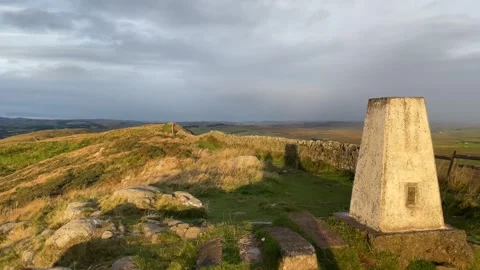 Trig Point on Hadrian's Wall. at sunrise, Northumberland, England, UK Stock Footage 285180784