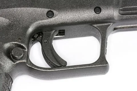 Trigger of hand gun on white background Stock Photos