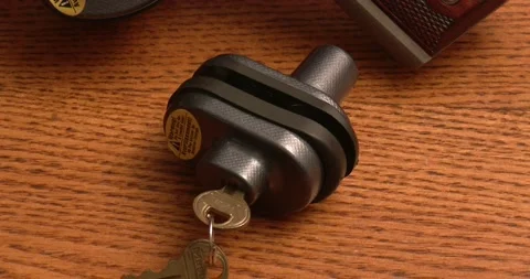 Trigger Lock on Table top - Gun Lock Stock Footage 196582330