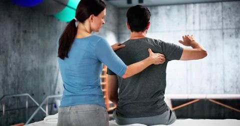 Trigger Point Back Massage Therapist Doing Physiotherapy Stock Photos