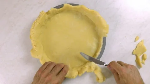 Trim excess of dough in baking pan Stock Footage 100195742
