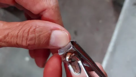 Trim the nail of the thumb Stock Footage 262536327