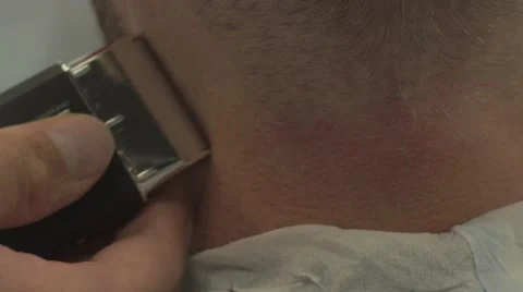 Trimming and polish a back of head /Close up 4k / Burbershop Stock Footage 58492162