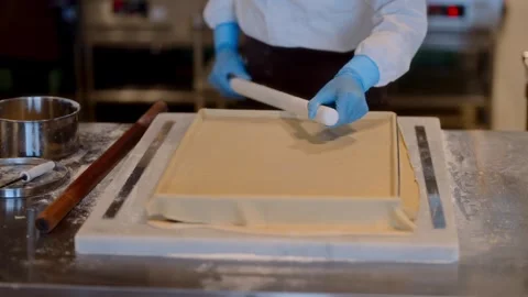 Trimming Dough and Docking Base for Even Baking Stock Footage 324712951