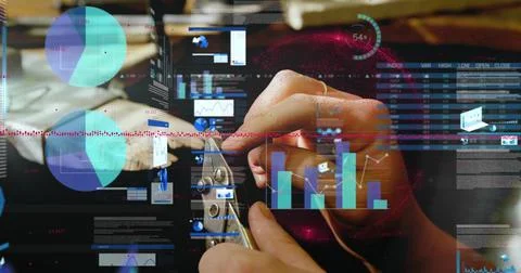Trimming tech's hands handling thin wire and small ring at workbench, with Stock Photos