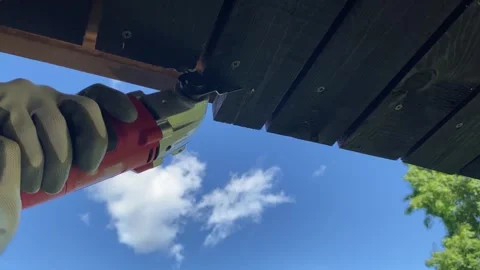 Trimming Wood Using Power Tool Under Blue Sky Видео 343865094