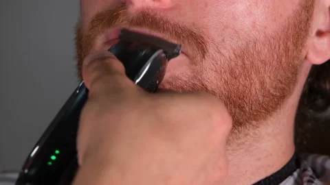 Trims red mustache Stock Footage 205484766