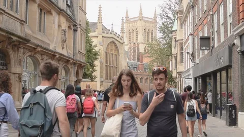 Trinity and St Johns street with pedestrians and view to Trinity College Stock Footage 92847312