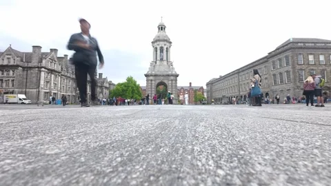 Trinity College Dublin - Tourists Walking Past the Campanile Bell Tower Video stock 338224132