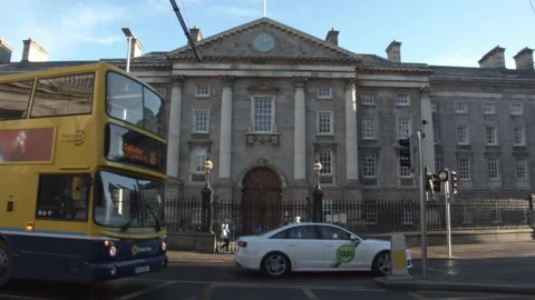 Trinity College Exterior front as busses pass Stock Footage 146841661