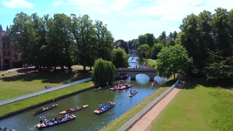 Trinity College Punts Under Bridge 4K Drone Footage Stock Footage 337908945