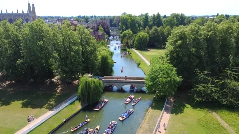 Trinity College Punts Under Bridge 4K Drone Footage Stock Footage 337908946