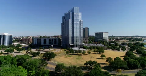 The Trinity river and the Pier 1 Imports tower in Fort Worth Stock Footage 201379622