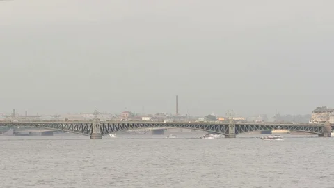 Trinity (Troitsky) Bridge on Neva river in cloudy day in summer Stock Footage 76432493