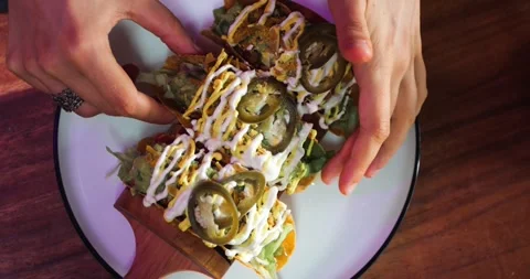 A Trio of Crispy Taco Shells Loaded With Walnut Meat, Iceberg Lettuce... Stock Footage 286434205