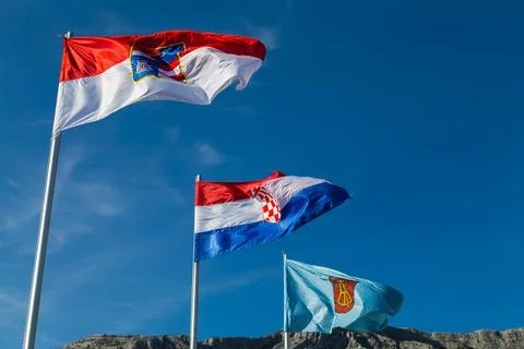 Trio of flags at Orebic Stock Photos