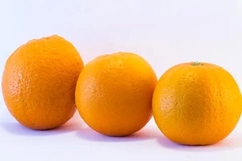 Trio oranges Stock Photos