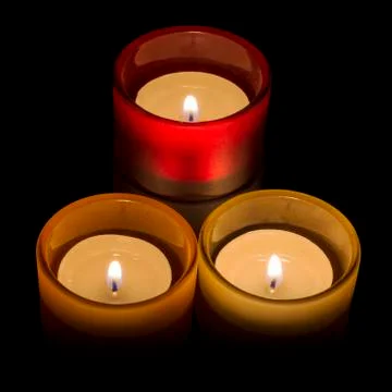 Trio of tea-lights Stock Photos