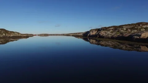 A trip along the water surface along the stones that frame the water Stock Footage 75465276