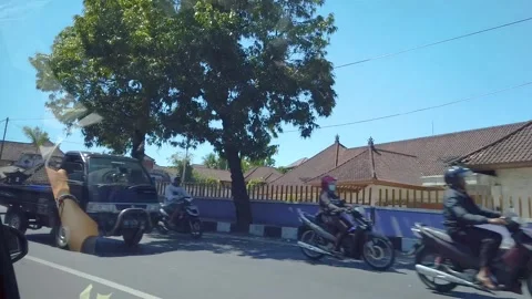 A trip to Bali, the view from the car window. Traffic on the road bali. Stock Footage 134256165