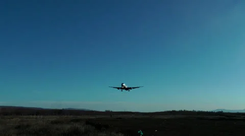 The trip big passenger plane soft-lands on a concrete runway Stock Footage 23698684