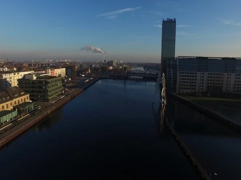 A trip with the drone above river, Berlin Oberbaumbruecke, Osthafen, aerial. Stock Footage 80058326