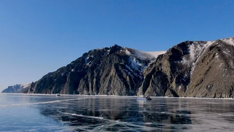 A trip on a powerful snowmobile through the great iced scenery of the reservoir Stock Footage 108721672