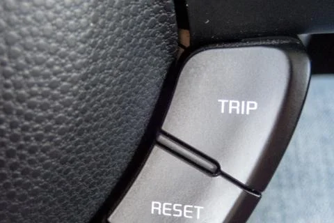 TRIP RESET  button inside a car. Crop fragment. Photos
