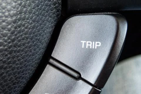 TRIP RESET  button inside a car. Crop fragment. 库存照片