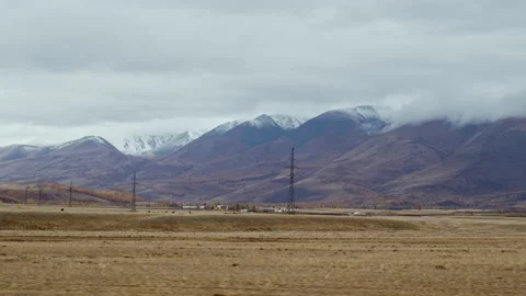Trip through steppe surrounded by ridge in autumn Stock Footage 228087826