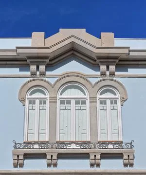 Tripartite window-second floor-blue front of Revivalist style mansion. Faro-PT Stock Photos