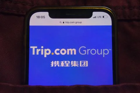 Trip.com Group Limited logo on mobile phone Stock Photos