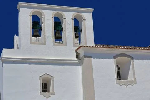 Triple bell gable-pristine blue sky-Our Lady of Carmel Church. Tavira-PT 스톡 사진