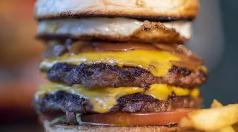 Triple burger. Stock Photos