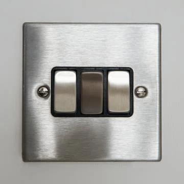 Triple light switch (silver grey metallic brushed aluminum) 写真素材