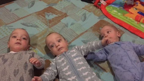 Triplets react hilariously to Daddy Stock Video Pond5